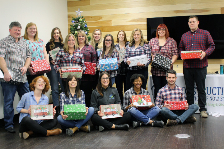 CANS Staff with their Christmas gifts prepared for the Shoebox project